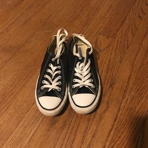 woman’s black and white converse